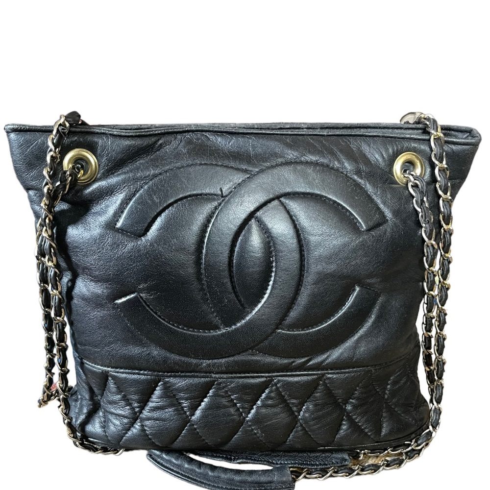 Vintage Chanel Black Quilted Lambskin Purse with logo in front and bottom